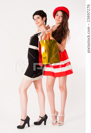 Two Pretty girls holding shopping bags 15697276