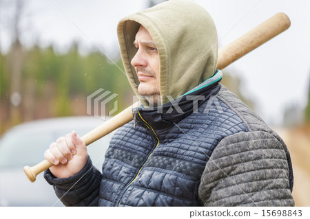 Man with a baseball bat near car Man with a baseball bat near car 15698843