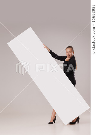Happy woman behind blank copy space banner 15698985