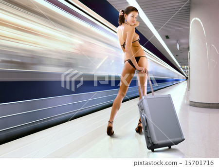 beautiful woman with luggage in subway 15701716