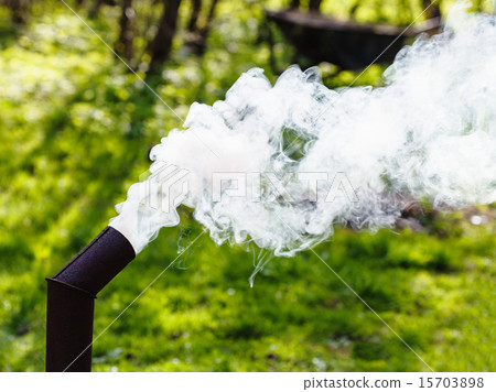 White smoke from the pipe of a samovar 15703898