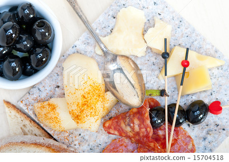 mix cold cut on a stone with fresh pears 15704518