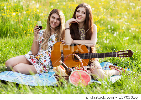 Two beautiful young women on a picnic 15705010