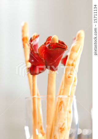 bread-stick with parma ham bread-stick with parma ham 15711134