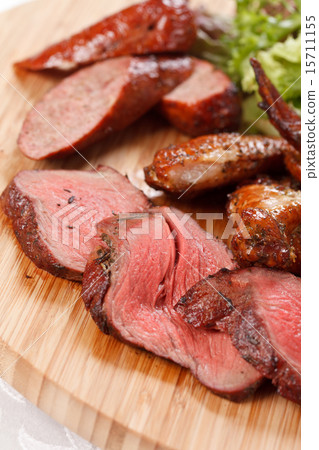 sausages on a wooden cutting board 15711155