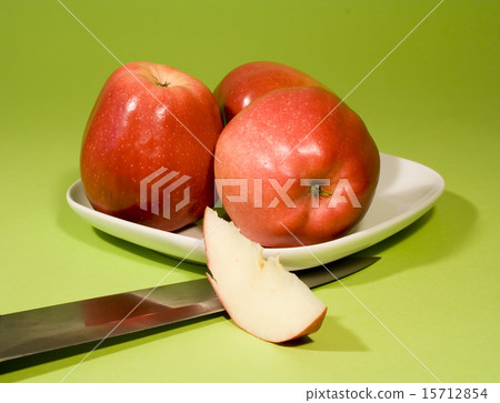 Red apples on green background 15712854