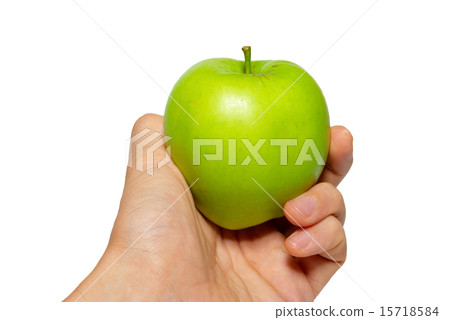 Green tasty apple in a hand isolated on white. 15718584