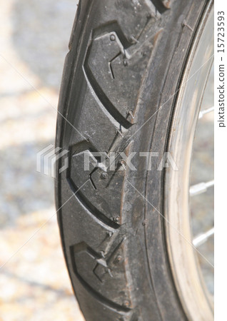 part of the wheel from the bicycle. part of the wheel from the bicycle. 15723593