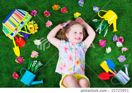 Kids on a lawn with garden tools Kids on a lawn with garden tools 15725951