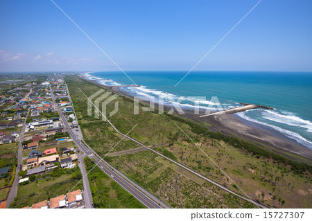 Aerial shot of long and beautiful coastline and surrounding city skyline Aerial shot of long and beautiful coastline and surrounding city skyline 15727307