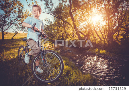 happy funny kid on bicycle. Active Leisure 15731829