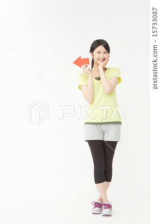 Sportswear women pointing with arrows 15733087