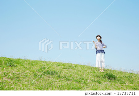 A woman guiding on a hill A woman guiding on a hill 15733711