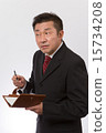Listen to a businessman with a notebook 15734208