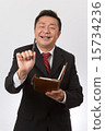 Listen to a businessman with a notebook 15734236