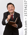 Listen to a businessman with a notebook 15734237
