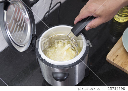 French fried in hot vegetable oil French fried in hot vegetable oil 15734398