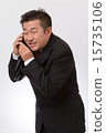 A businessman who apologizes over the mobile phone 15735106