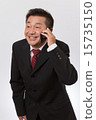 A business person bowing over the mobile phone 15735150
