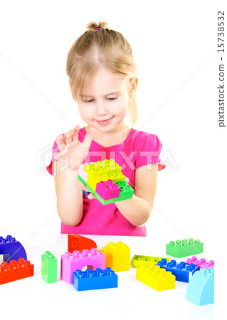 Little Girl Plays Block Isolated on White Background Little Girl Plays Block Isolated on White Background 15738532