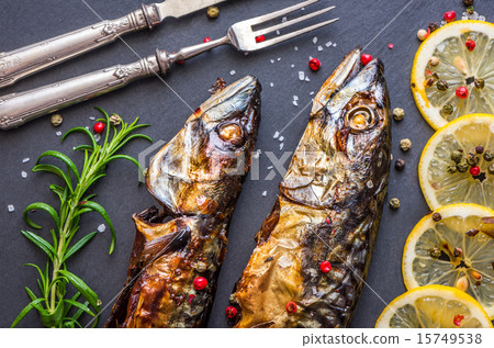 Baked Mackerel Fish with Herbs and Lemon on Stone 15749538