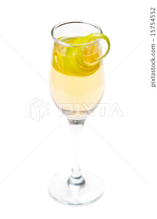 Yellow cocktail in glass with lemon twist 15754552