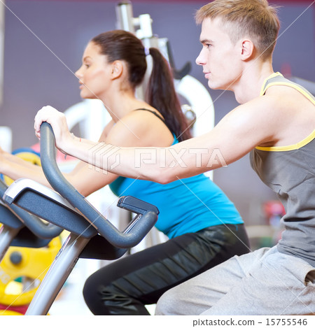 People in the gym doing cardio cycling training 15755546