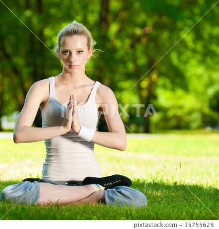Young woman doing yoga exercise Young woman doing yoga exercise 15755628