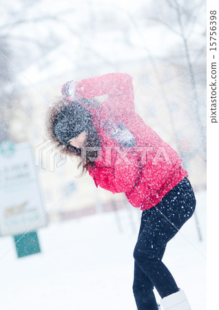 Happy young woman plays with a snow Happy young woman plays with a snow 15756398