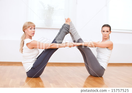 Women doing yoga exercise at gym 15757525