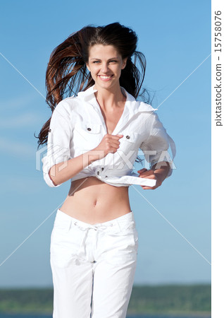 Sporty woman running in sea coast 15758076