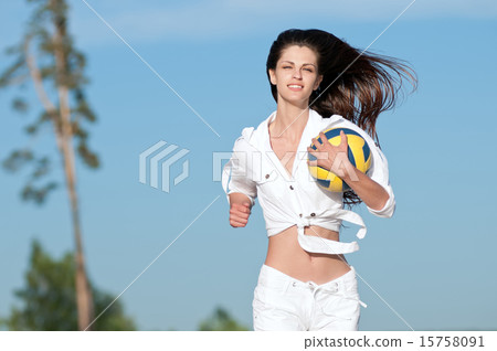 Woman playing volleyball on beach Woman playing volleyball on beach 15758091