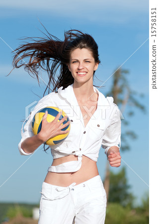 Woman playing volleyball on beach 15758151