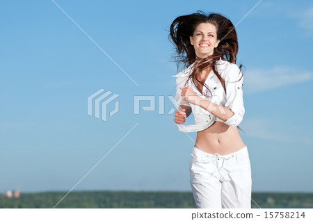 Sporty woman running in sea coast 15758214