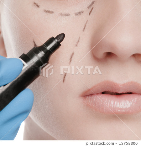 Beautician draw correction lines on woman face 15758800