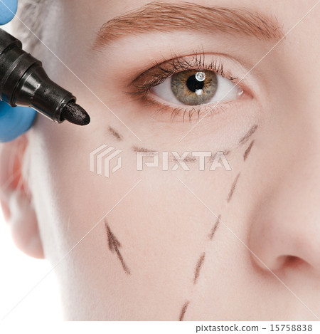 Beautician draw correction lines on woman face 15758838