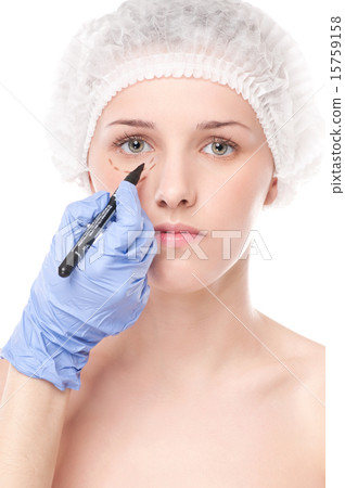 Beautician draw correction lines on woman face 15759158