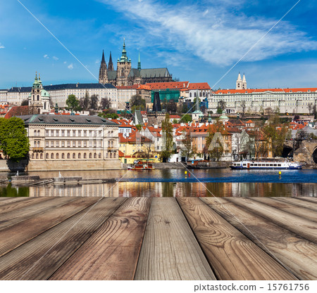 Wooden planks vith view of Prague Charles bridge over Vltava riv 15761756