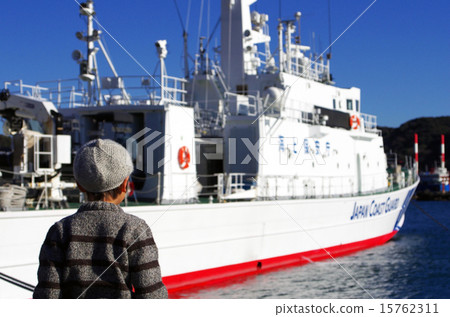 Japan Coast Guard boat and child at Shimoda Port 15762311