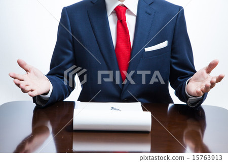 A gesturing businessman 15763913