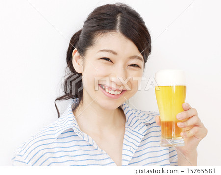 A woman holding a beer A woman holding a beer 15765581