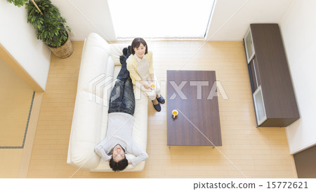 Middle couple relaxing on the sofa 15772621