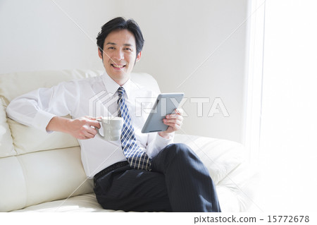 Business man relaxing on sofa Business man relaxing on sofa 15772678