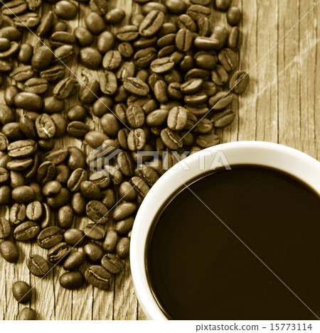 cup of coffee and roasted coffee beans, sepia cup of coffee and roasted coffee beans, sepia 15773114