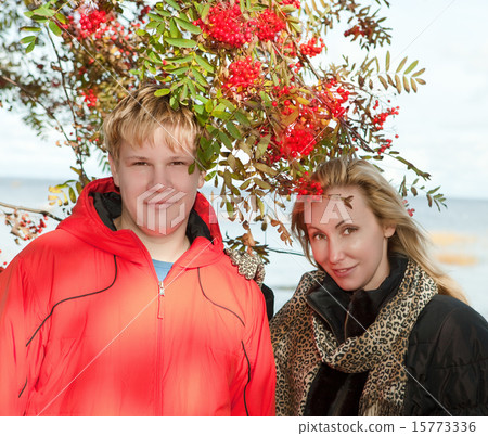 Young people at a mountain ash bush Young people at a mountain ash bush 15773336
