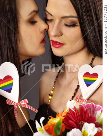 Lesbian women with heard in erotic foreplay game Lesbian women with heard in erotic foreplay game 15775232