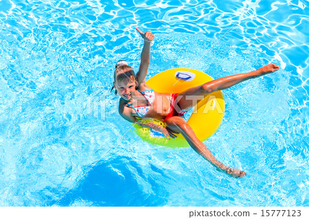 Child swimming on inflatable beach mattress. Child swimming on inflatable beach mattress. 15777123