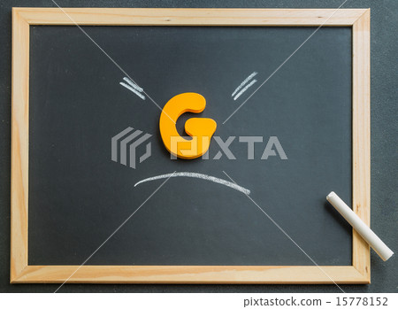 Wooden G charactor on black board Wooden G charactor on black board 15778152