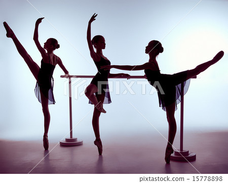 Ballerinas stretching on the bar 15778898
