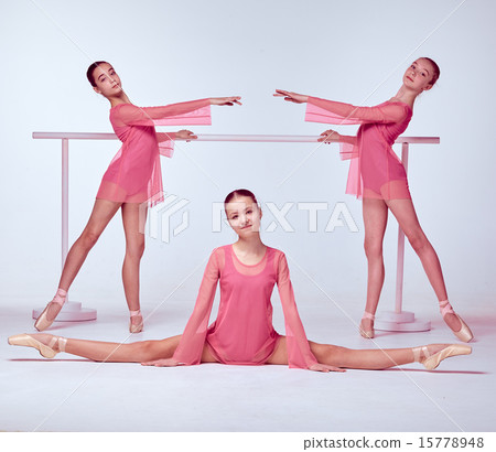 Ballerinas stretching on the bar 15778948